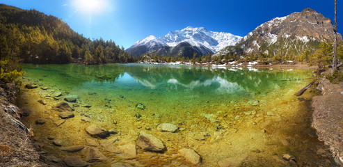 Wall Mural - turquoise treasure. beautiful mountain lake with crystal clear water surrounded by hills and mountai