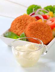 Canvas Print - Fried cheese with vegetable salad and mayonnaise