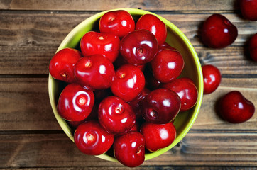 Poster - Bowl with cherries on wooden table