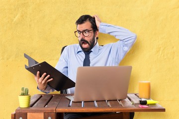 Wall Mural - Frustrated businessman in his office with his folder