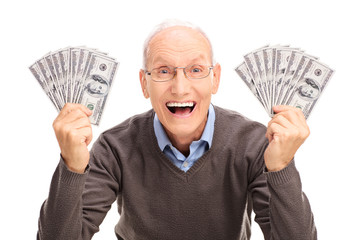 Canvas Print - Joyful senior holding money in both hands