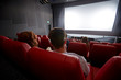 © Syda Productions - happy couple watching movie in theater or cinema