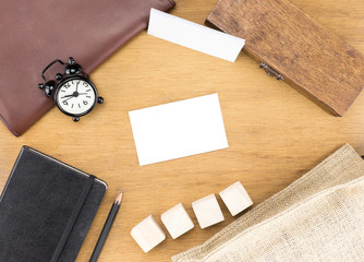Poster - Wooden Table top with  clock,type box,notebook,leather bag and p