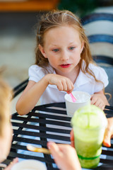 Canvas Print - Little girl eating ice cream