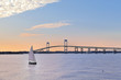 © Marianne Campolongo - Newport Bridge twilight sunset with sailboats Rhode Island USA a popular New England holiday vacation destination.