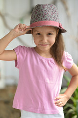 Wall Mural - Little girl in hat posing