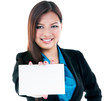 © iPortret - Cute young businesswoman holding blank card against white background. Focus on blank card.