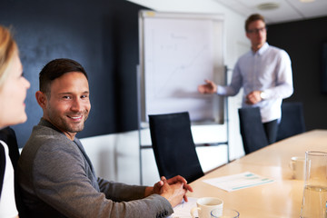 Wall Mural - White male executive smiling and facing camera