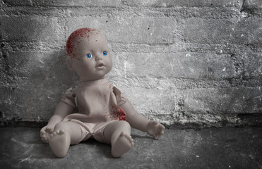 Wall Mural - Concept of child abuse - Bloody doll