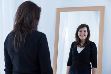 Girl wearing a fake smile