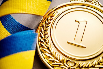 Wall Mural - gold medal on a dark blue background