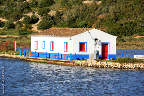 Fotografia, Obraz Fisherman's cottage situated in Portimao, Algarve. Portugal.
