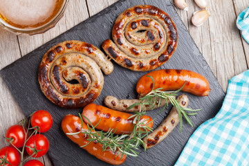 Wall Mural - Grilled sausages and beer mug