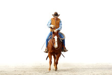 Mountain Cowboy Riding His Horse In The Dirt With A Blank White Background For Text..