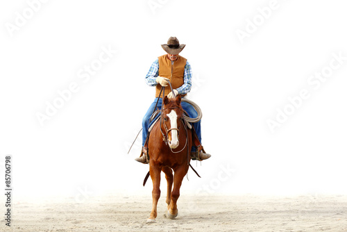 Fotografía Mountain cowboy riding his horse in the dirt with a blank white background for text