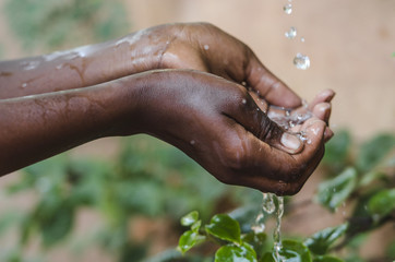 climate change symbol: handful of water scarcity for africa symbol