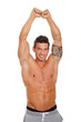 © petrdlouhy - Handsome muscular man stretching his arms above his head