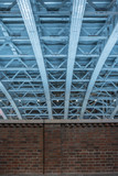 Fototapeta Most - Low angle view of steel roof structure