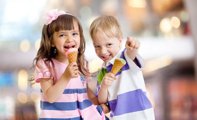 happy kids eating ice cream on nice bokeh background