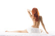 © Acronym - Sexy redhead woman with a naked back isolated on white