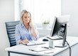 © Acronym - Young, attractive and confident business woman working in office