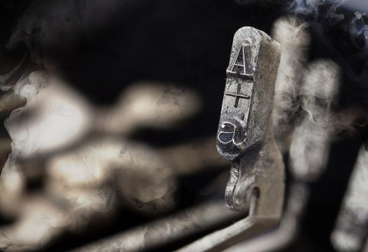 A hammer - old manual typewriter - mystery smoke
