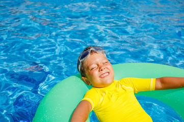 Wall Mural - Little boy relax in pool