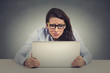 © pathdoc - Stressed young woman looking at laptop screen