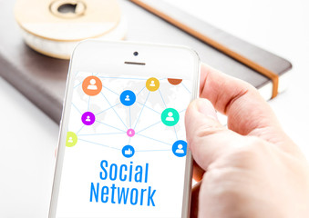 Poster - Close up hand holding smart phone with Social network word and i