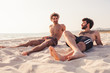 Portrait. Couple of male friends at sunset on the beach on a day of rest summer vacation together, after spending a day of relaxation and fun