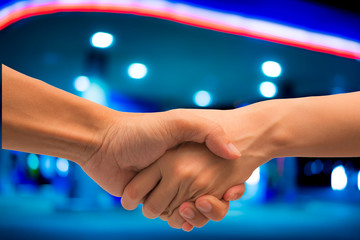 Canvas Print - Buseness man and woman make hand shake as success agreement concept.