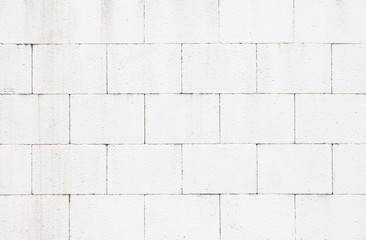 The modern white concrete tile wall background and texture..