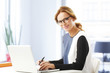 © sepy - Middle age businesswoman with laptop