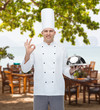 © Syda Productions - happy male chef cook with cloche showing ok sign