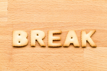 Wall Mural - Word break cookie over the wooden background