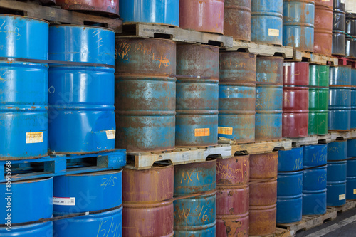 Fotografia, Obraz Rows of stacked steel barrels of various colors