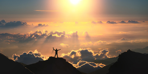 On the top of the world. A man standing on the top of the mountain above the clouds. 