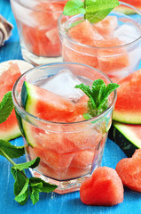 Wall Mural - Refreshing watermelon drink with mint and ice cubes. Selective focus