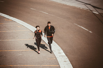 Couple running in an urban environment. Bird`s eye view