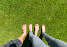 Two Pairs Of Bare Feet 