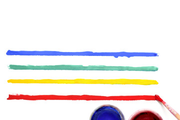 Brush with paint and colored stripes