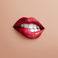 Bites Separate Lips On A Beige Background