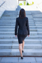 Career Concept - Back View Of Business Woman On Stairs
