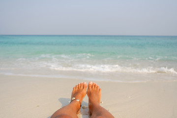 Woman's Bare Feet on the beach.