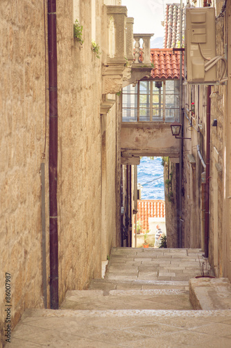 Naklejka ścienna Beautiful old street in Croatia with a sea view