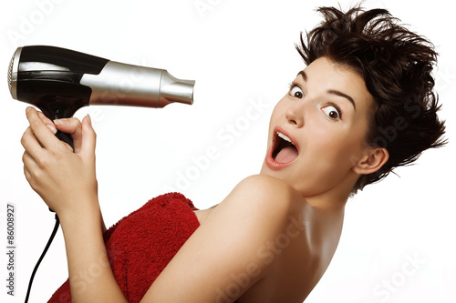 Fototapeta na wymiar girl with hair dryer