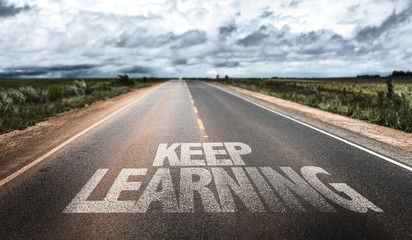 keep learning written on rural road