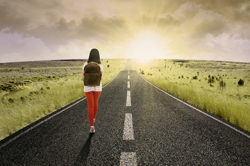 student walking toward bright future