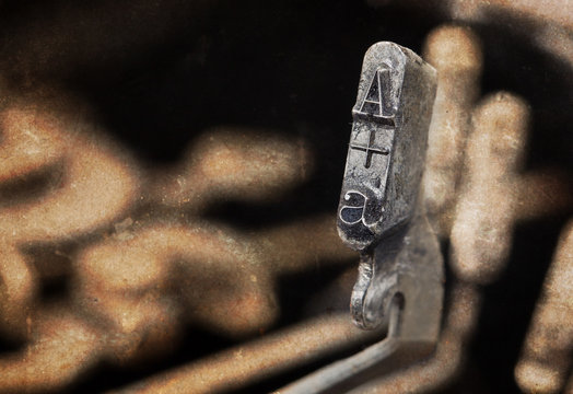 A hammer - old manual typewriter - warm filter