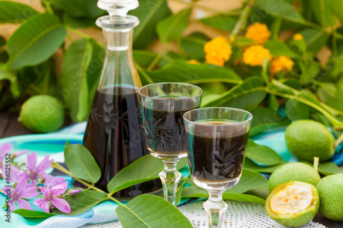 Fotografie, Obraz Liqueur from young green walnuts, remedy for stomach ache